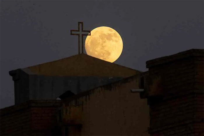 The supermoon over a church in Basra, Iraq