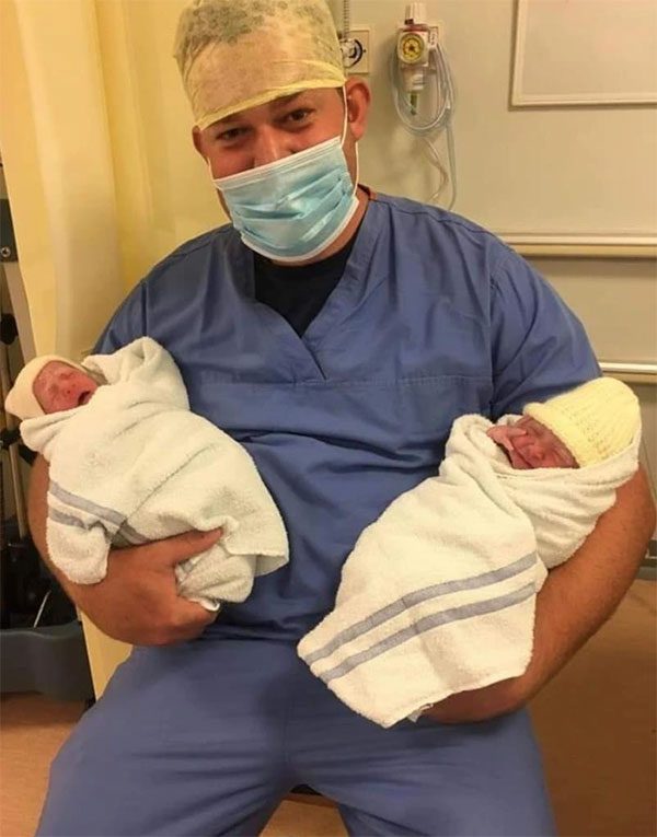 Sophie Small's husband, Jonathan, taken with their newborn daughters.
