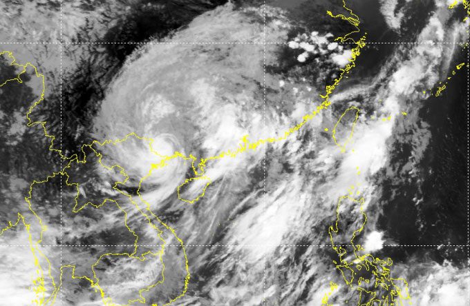 The eye of the storm (white spiral) nearing the Vietnam-China border, noon July 18.