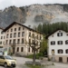 the swiss person had to leave the beautiful village like a painting to attend a party 127529