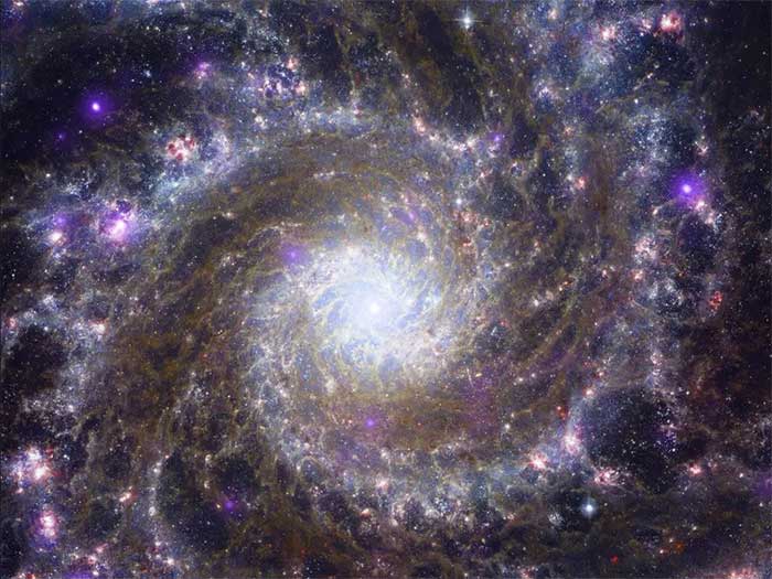 Messier 74 (M74) is also a spiral galaxy, located 32 million light-years from Earth