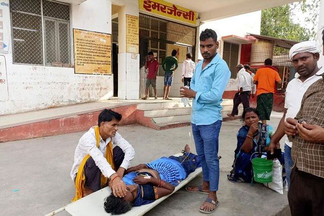 Relatives care for a patient on a stretcher