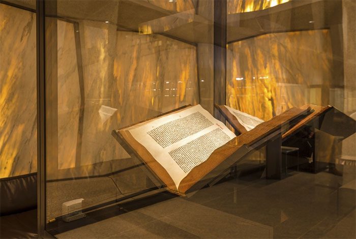 A Gutenberg Bible is carefully protected
