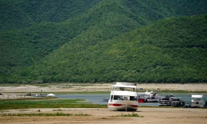 A boat stranded in the Boca water reservoir in Santiago, Mexico due to drought.
