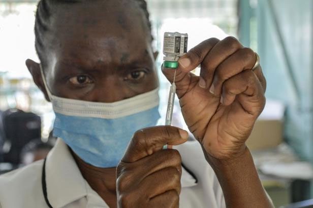 Healthcare workers vaccinating children against malaria in Yala, Kenya