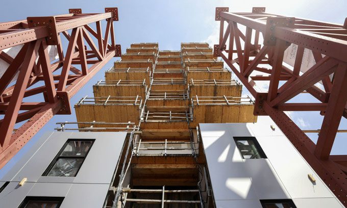 The protective towers of the wooden building during testing