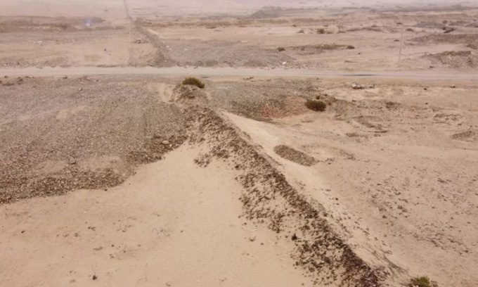 Remains of a 10km long earthen wall running through the desert in northern Peru.