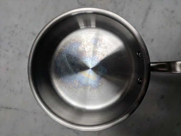 Rainbow streaks are often found on the bottoms of stainless steel cookware.
