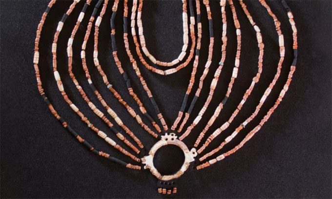 The physical recreation of the 9,000-year-old necklace displayed at the Petra Museum, Jordan.