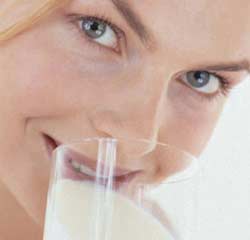 Mother drinking milk, heavier baby