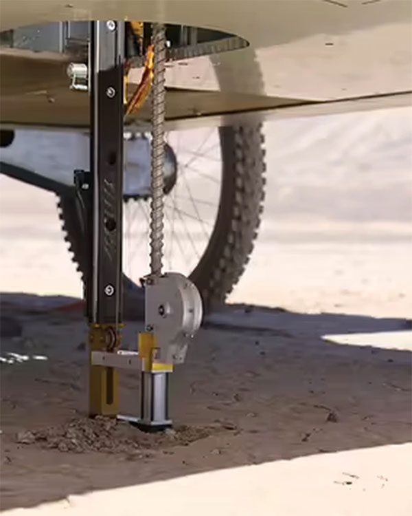 The rover digging into the ground to search for bacteria.