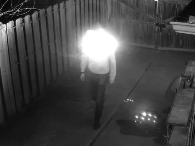 High-power infrared lights attached to the hoodie obscure the wearer's face when viewed through a camera