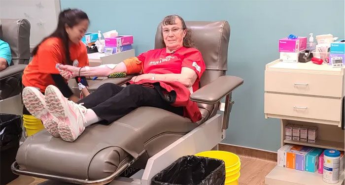 Elderly woman Josephine Michaluk donating blood.