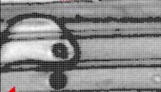T-ray imaging shows scratches on a car's fender that conventional images do not reveal.