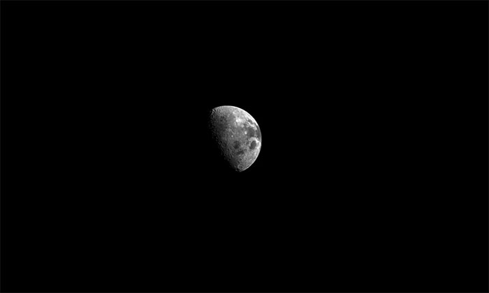 The Orion spacecraft "looks back" at the Moon after orbiting the celestial body.