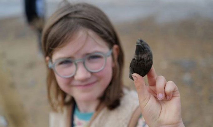 Etta discovered a 700,000-year-old bear tooth on the beach in Norfolk.