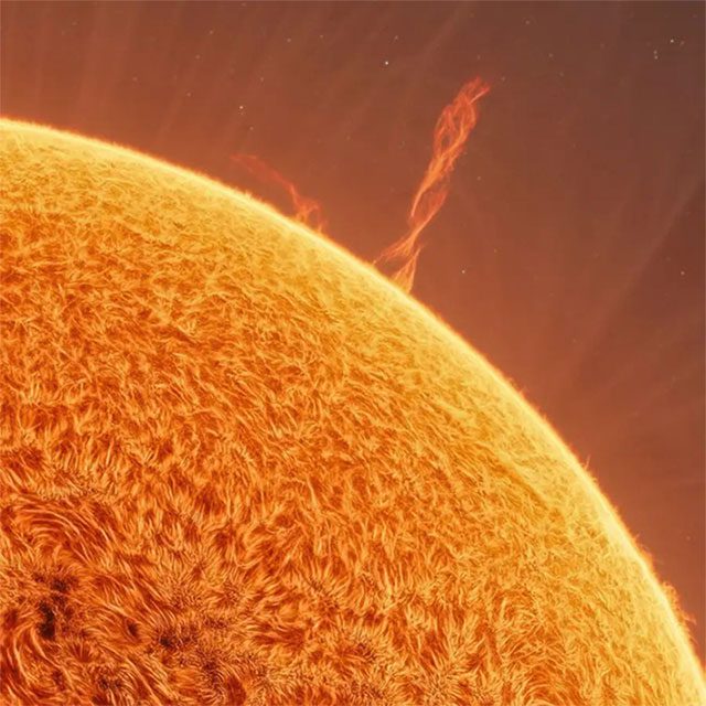 Close-up of the Sun's surface with plasma rays and a plasma vortex.