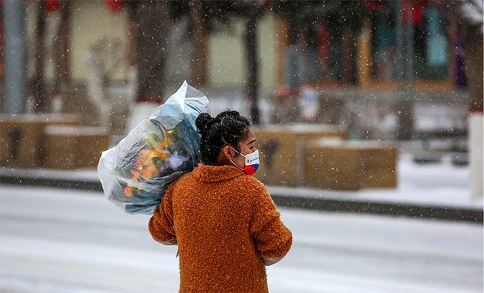 Residents busy in the snow as the year-end approaches.