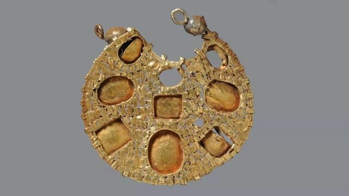 Back view of a gold earring