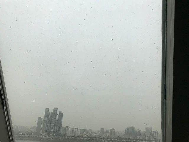 Dust accumulated on the glass window of a building in Seoul