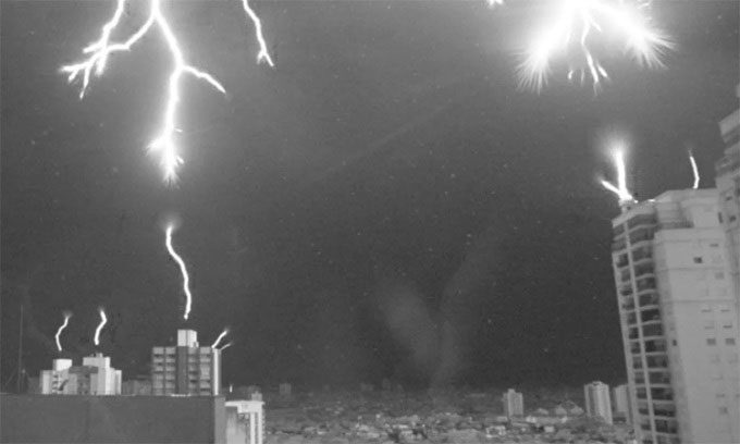 Lightning rods attempting to connect with the downward electric flow.