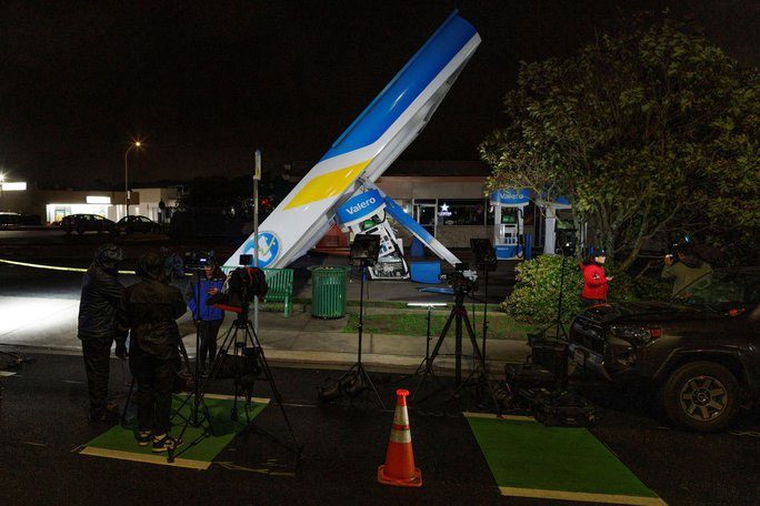 A "live" interview in front of a collapsed gas station