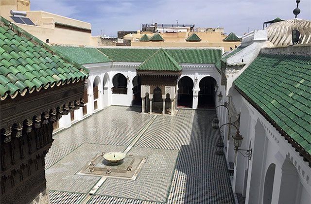 Al-Qarawiyyin University stands out with its green-tiled roof.
