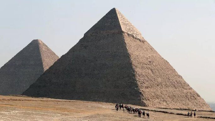 The Great Pyramid is seen in the background as the largest in the pyramid complex at Giza