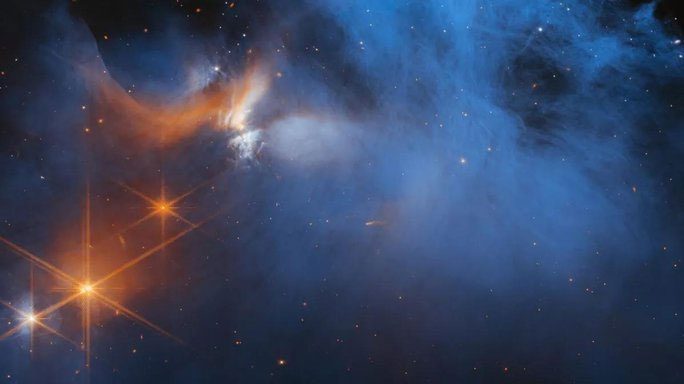 A thin blue molecular gas cloud with glowing spots from distant stars