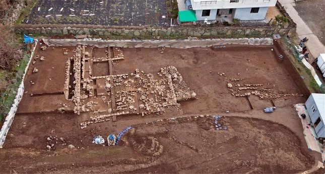 Archaeological excavation site on Jeju Island, South Korea.