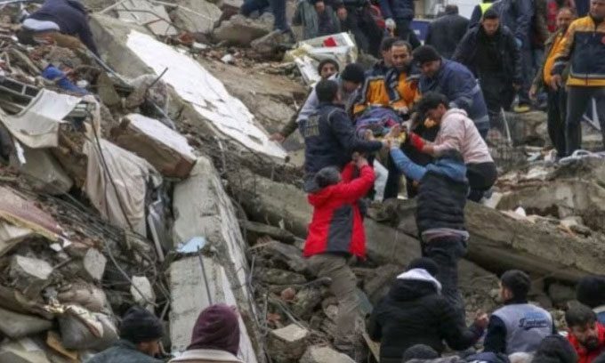Rescue team saving a citizen from a collapsed building in Adana, Turkey.