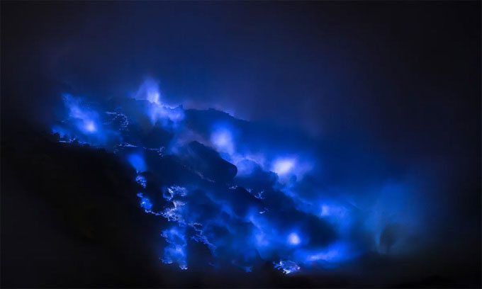 Blue lava on Ijen volcano at night.