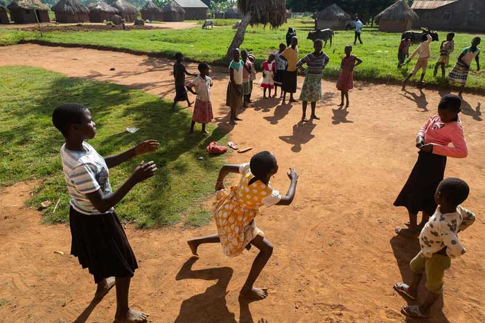 Some of Musa Hasahya's grandchildren playing a traditional game outside their home.