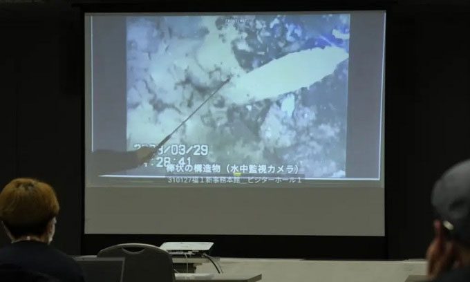 Image captured by a robotic probe reveals exposed rebar at the reactor support pedestal.