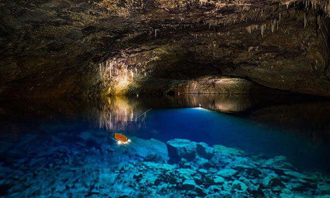 The Sunfish autonomous submersible mapping part of the underground lake in Dragon's Breath cave.