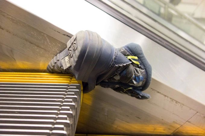 Standing too close to the escalator edge can lead to dangerous accidents.