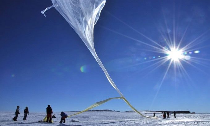 NASA scientists prepare to launch one of 20 balloons during a scientific mission in 2013.