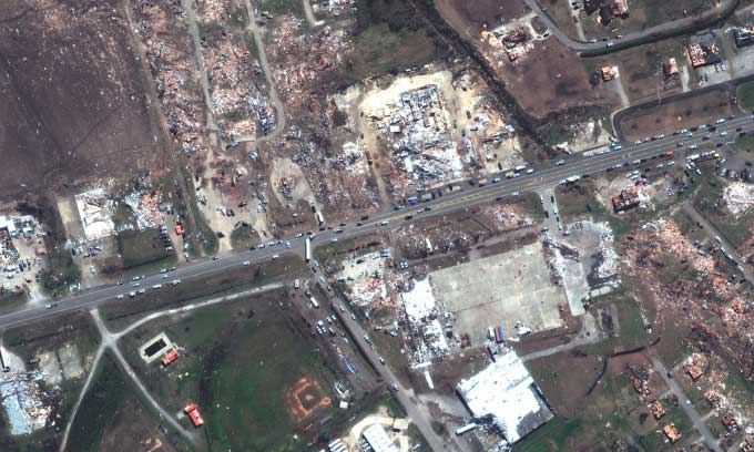Satellite image of destroyed homes and businesses along Blues Highway