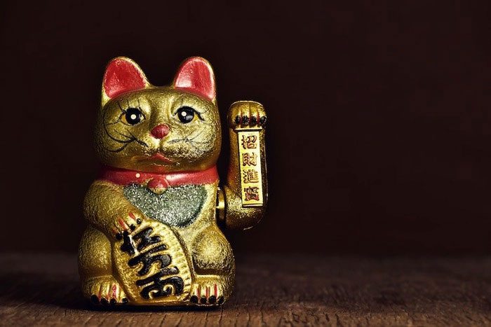 Maneki-neko is often displayed at the entrances of businesses.