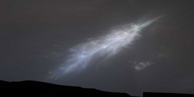 Curiosity rover capturing a colorful feather-like cloud right after sunset on January 27.