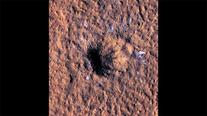 A 150m wide crater formed after a meteorite impact on Mars