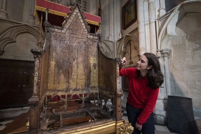 Restorer Krista Blessley cleaning the coronation chair.