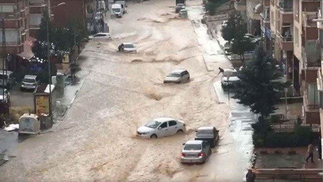 Vehicles swept away in the floodwaters.