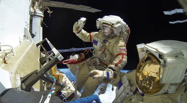 Astronauts conducting a spacewalk in November 2022.