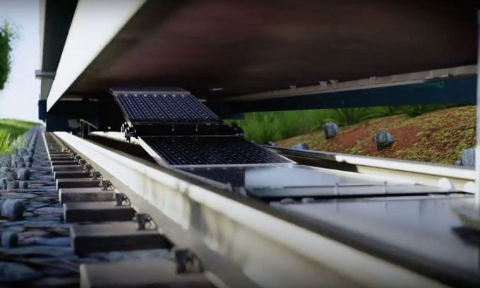 Solar panels are laid along the tracks using a special train.