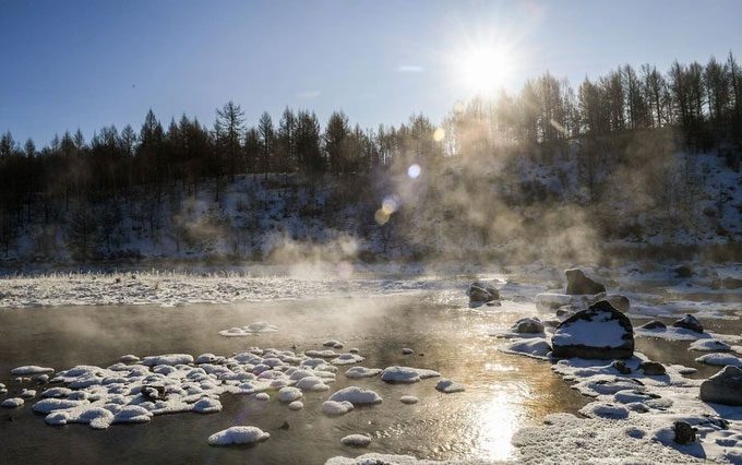 A mystical mist rising from the riverbed.