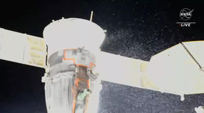 The Russian Soyuz spacecraft experiencing a leak, with a "cloud" of coolant surrounding its body