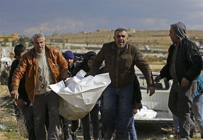 Transporting the body of a victim after the earthquake in Aleppo, northern Syria on February 7.