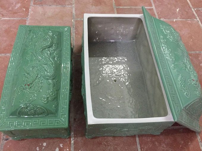 The smaller inner coffin placed inside the tomb.