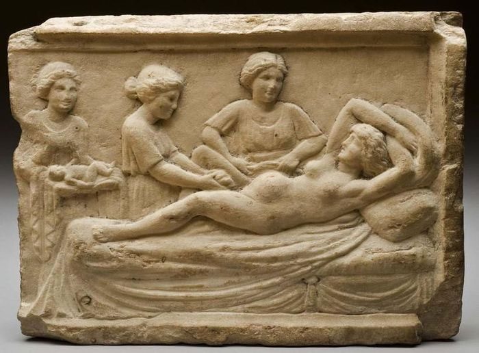 Childbirth scene in ancient times - a depiction unearthed in Ostia, Italy.